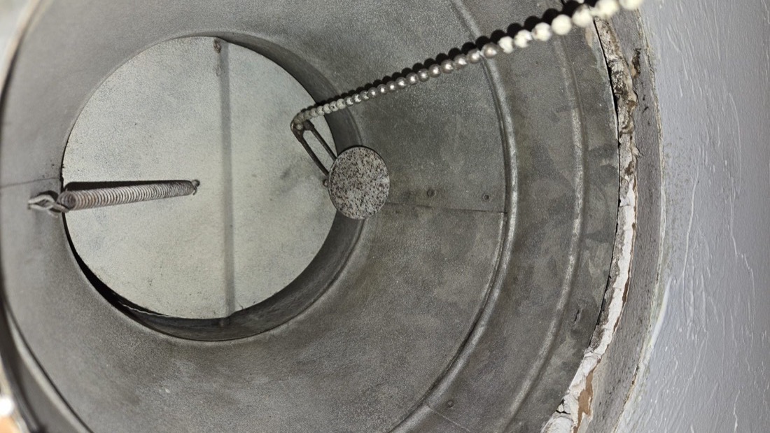 Ductwork damper and interior during cleaning process