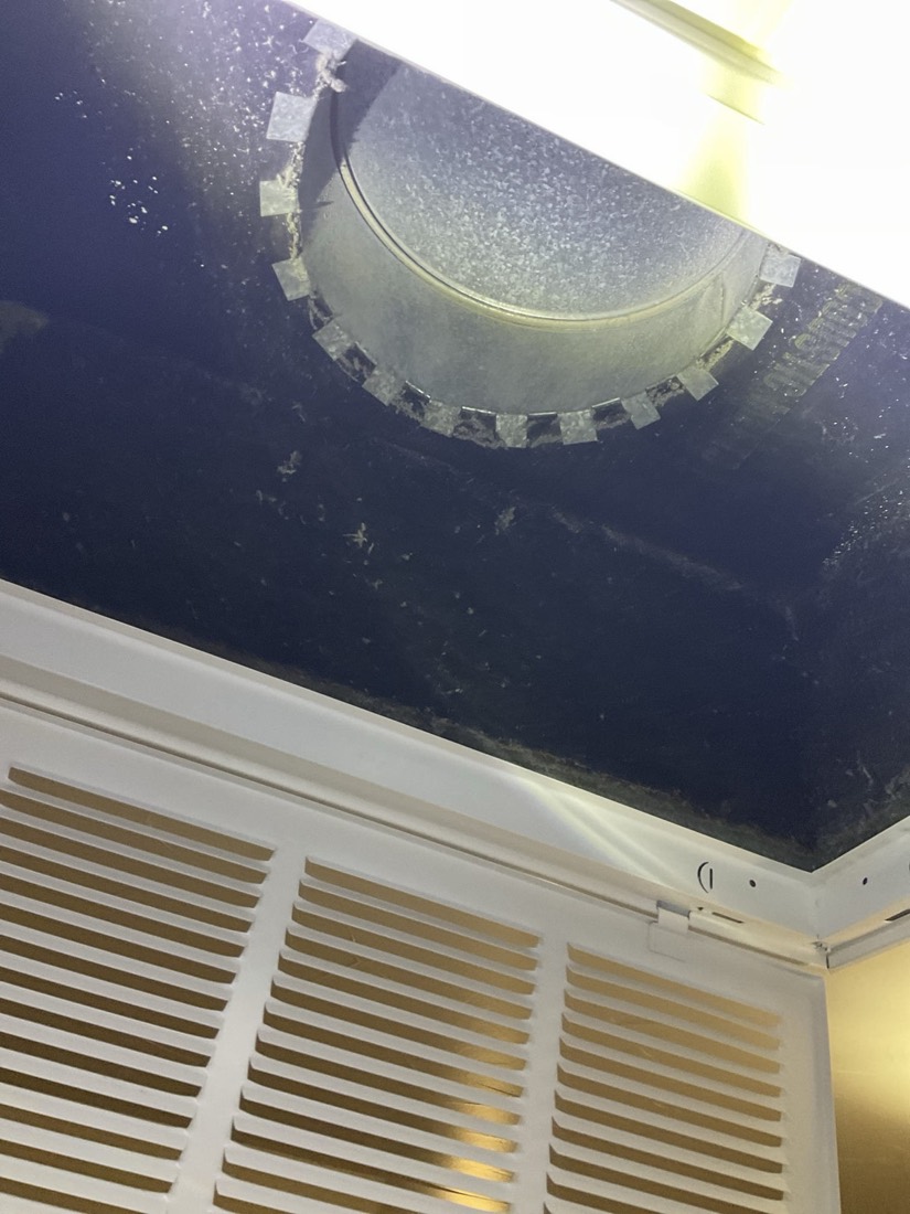 Clean register dampers visible with return air vents below.