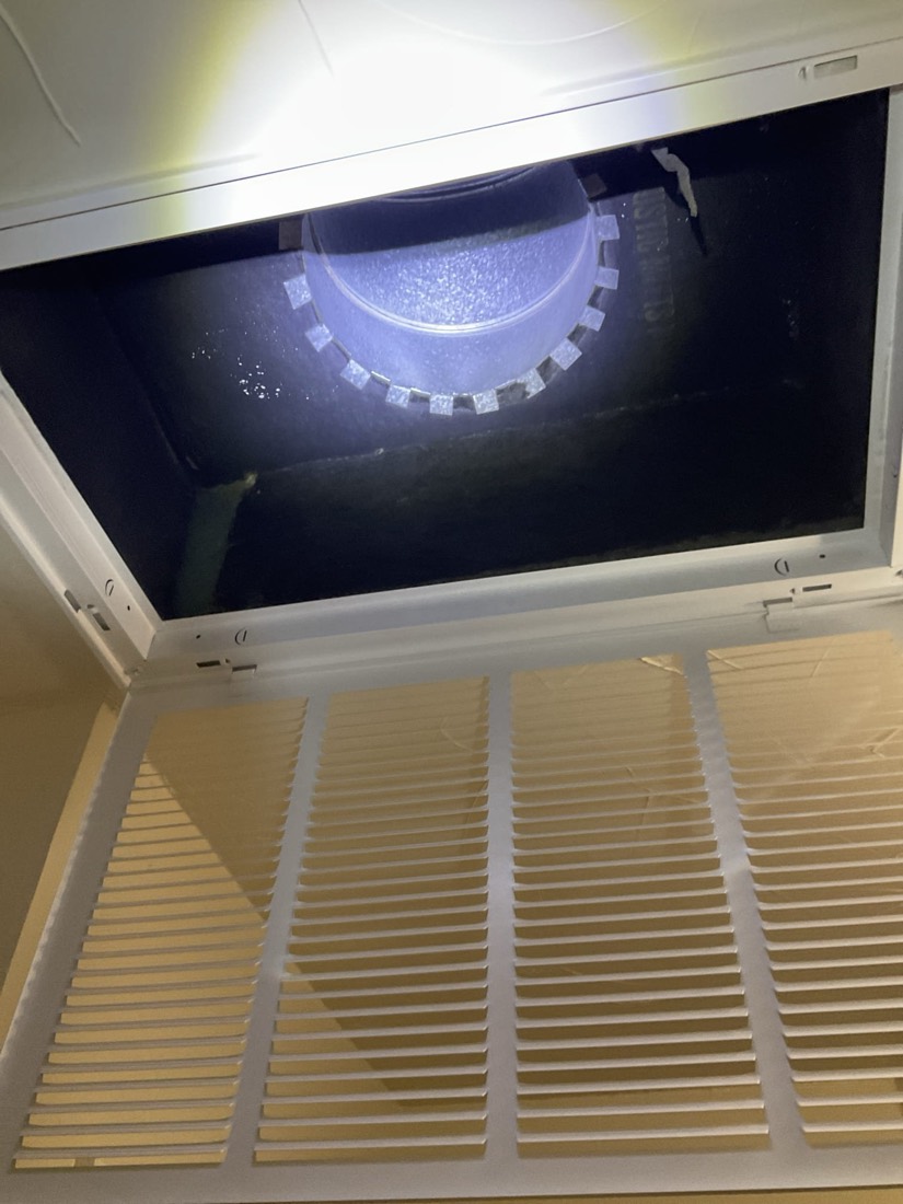 Clean duct register viewed from below with floor vents.