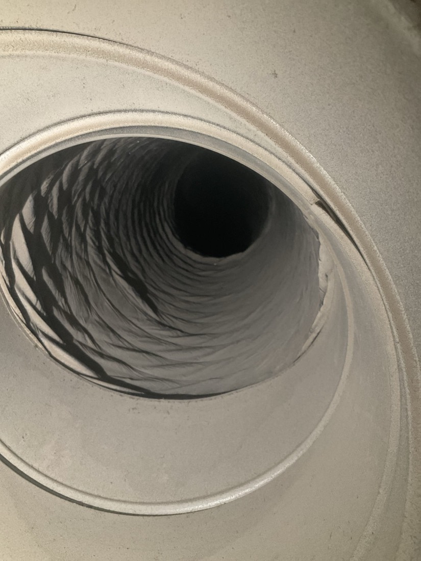 Close-up view of clean ductwork interior with visible spiral pattern.