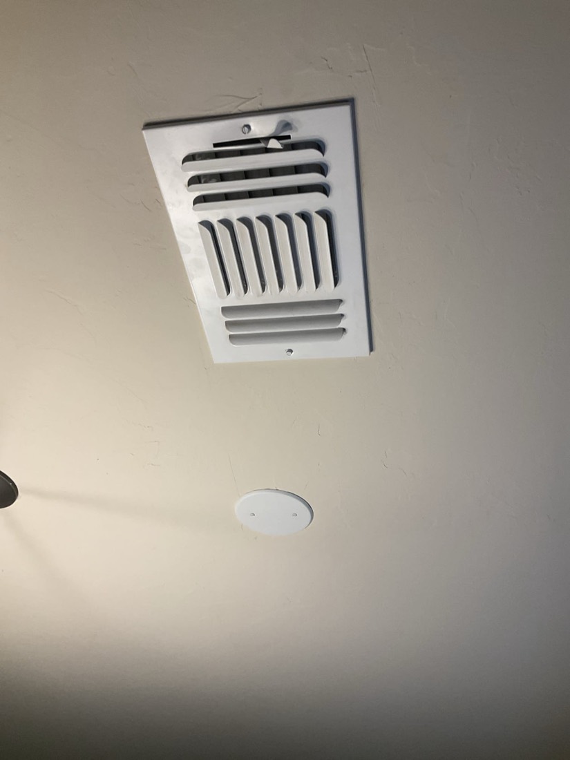 Clean white ceiling air supply vent register
