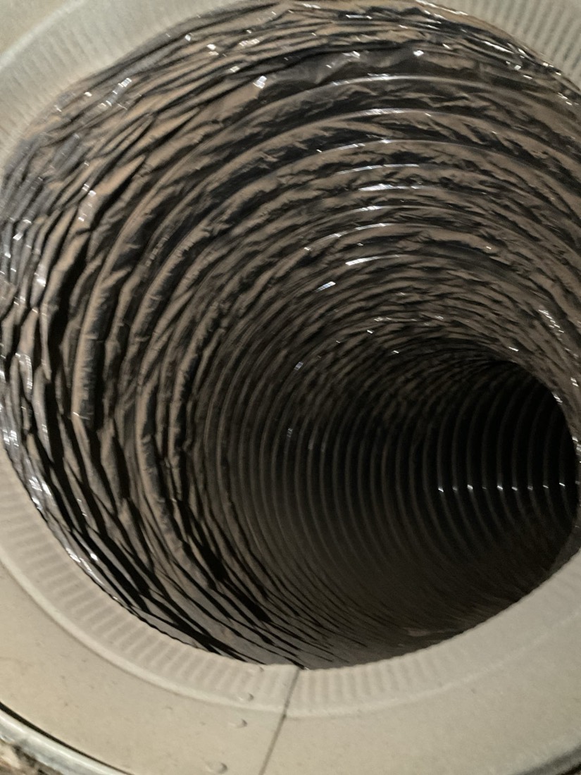 Clean flexible ductwork with white collar ring.