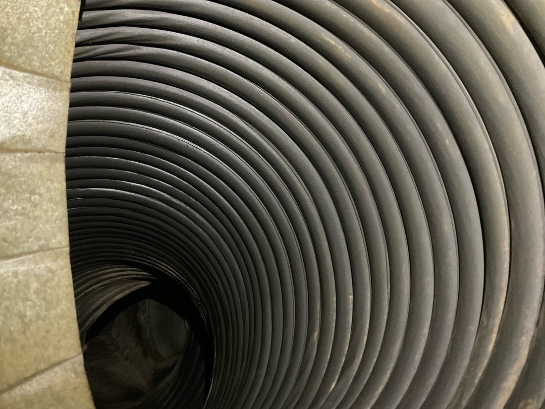 Close-up of black flexible ductwork coils
