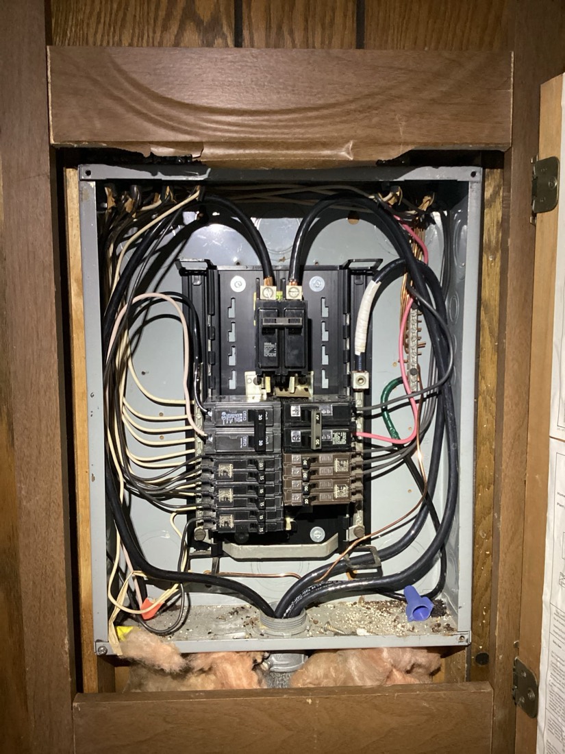 New electrical panel with organized wiring installation.