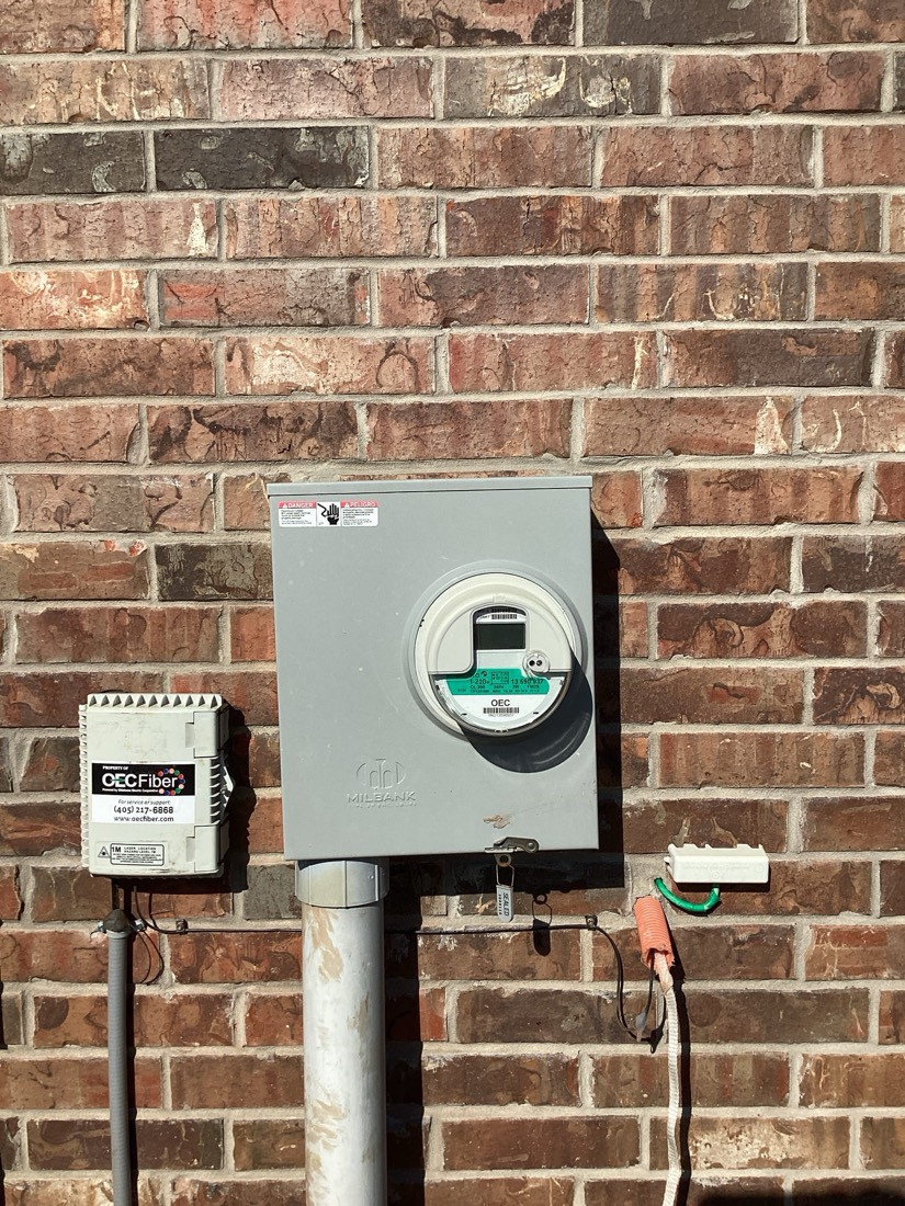 Electrical meter and disconnect on brick exterior