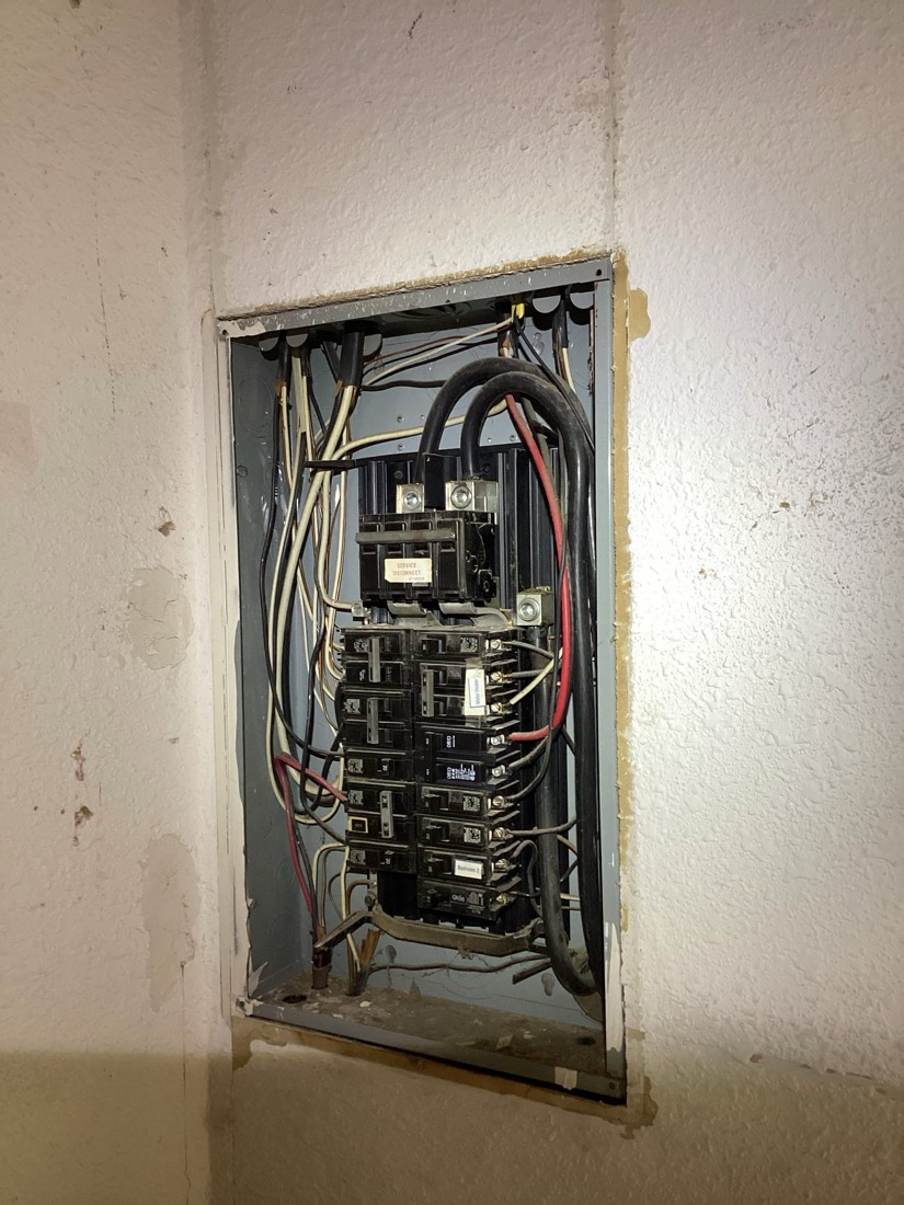Installed electrical service panel with breaker circuits neatly arranged