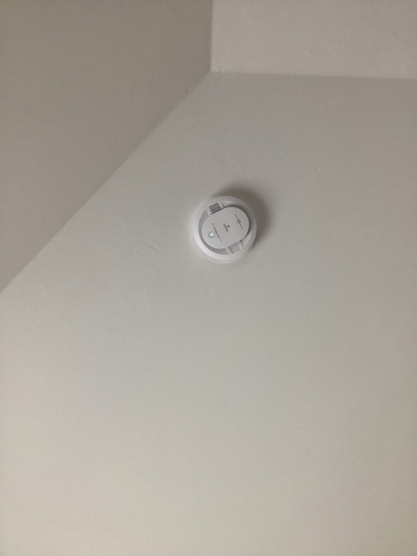 Smart thermostat installed on ceiling