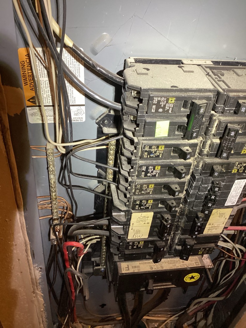 Upgraded electrical panel with organized breaker circuits