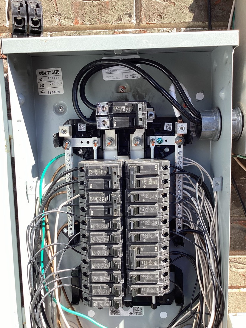 Main electrical panel with organized breaker installation and wiring.