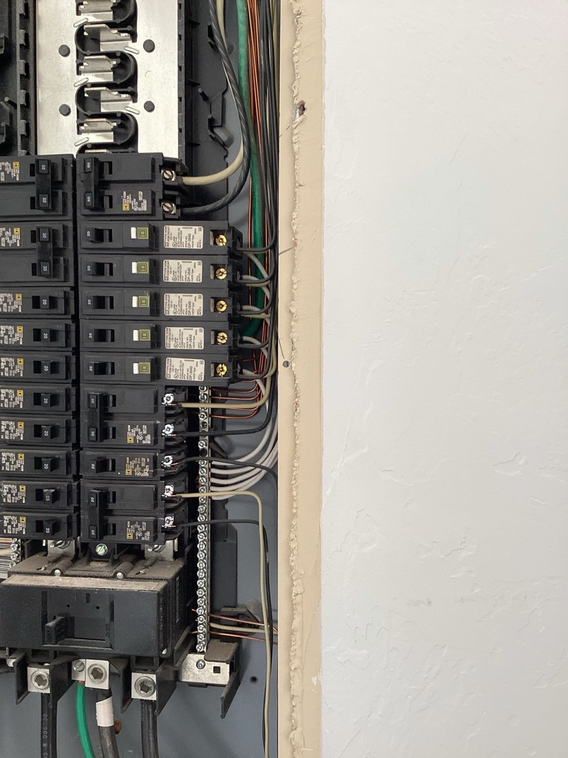 Professional electrical panel installation with organized wiring