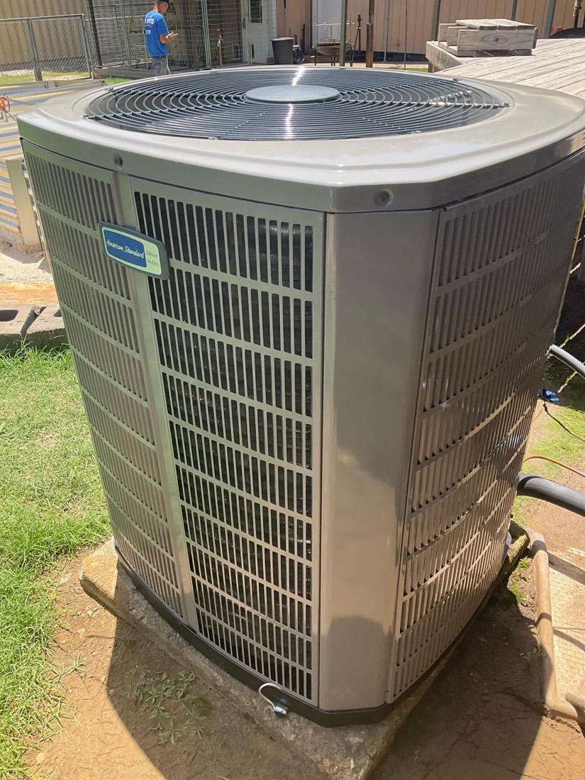 Installed AC condenser unit in outdoor setting