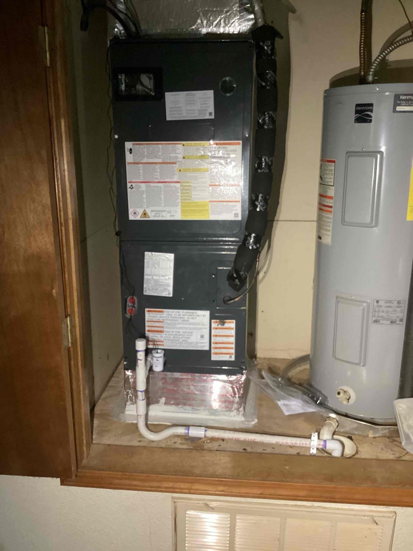 Furnace and water heater in utility closet