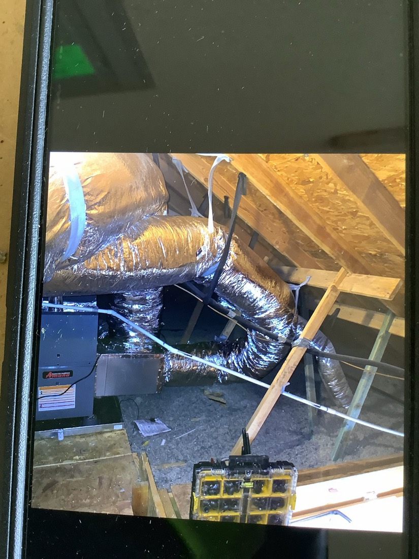 Furnace unit with insulated ducts and flexible connectors in attic space