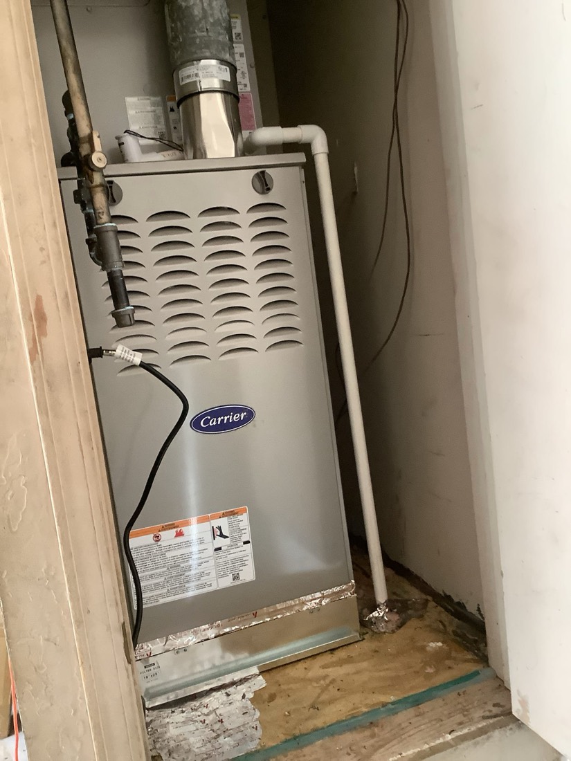 Carrier furnace installation with ventilation ductwork