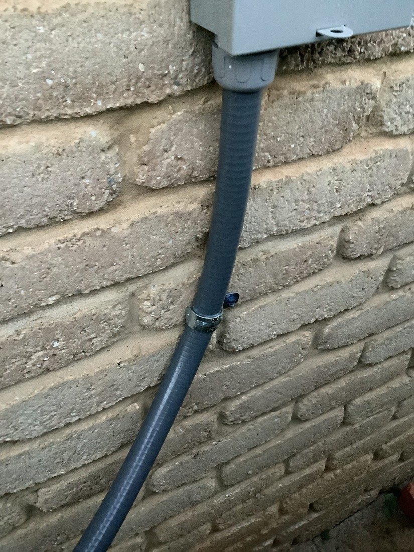 Properly installed and sealed condensate drain pipe on AC unit