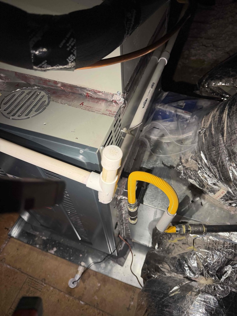 Furnace and AC indoor unit with yellow ductwork installed