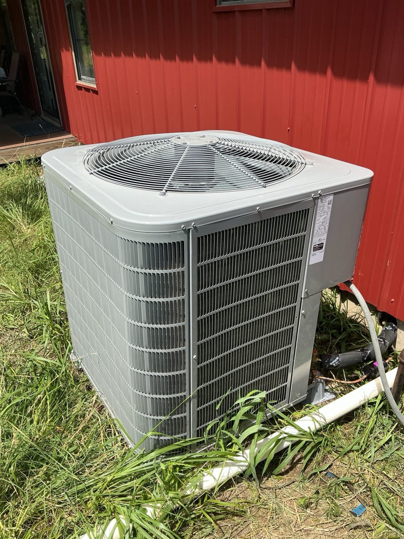 Newly installed AC condenser unit at home.