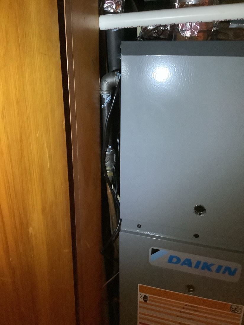 Daikin gas furnace installation with refrigerant line connection