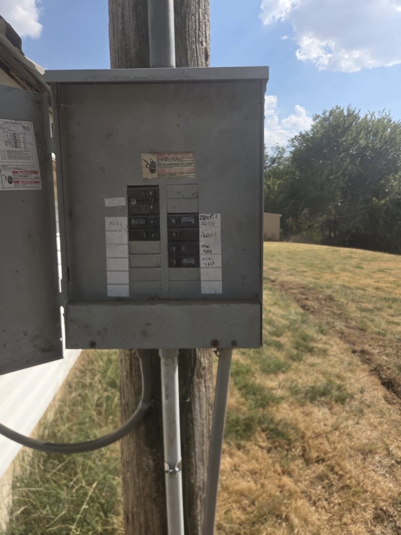 Installed electrical panel with breakers on exterior pole