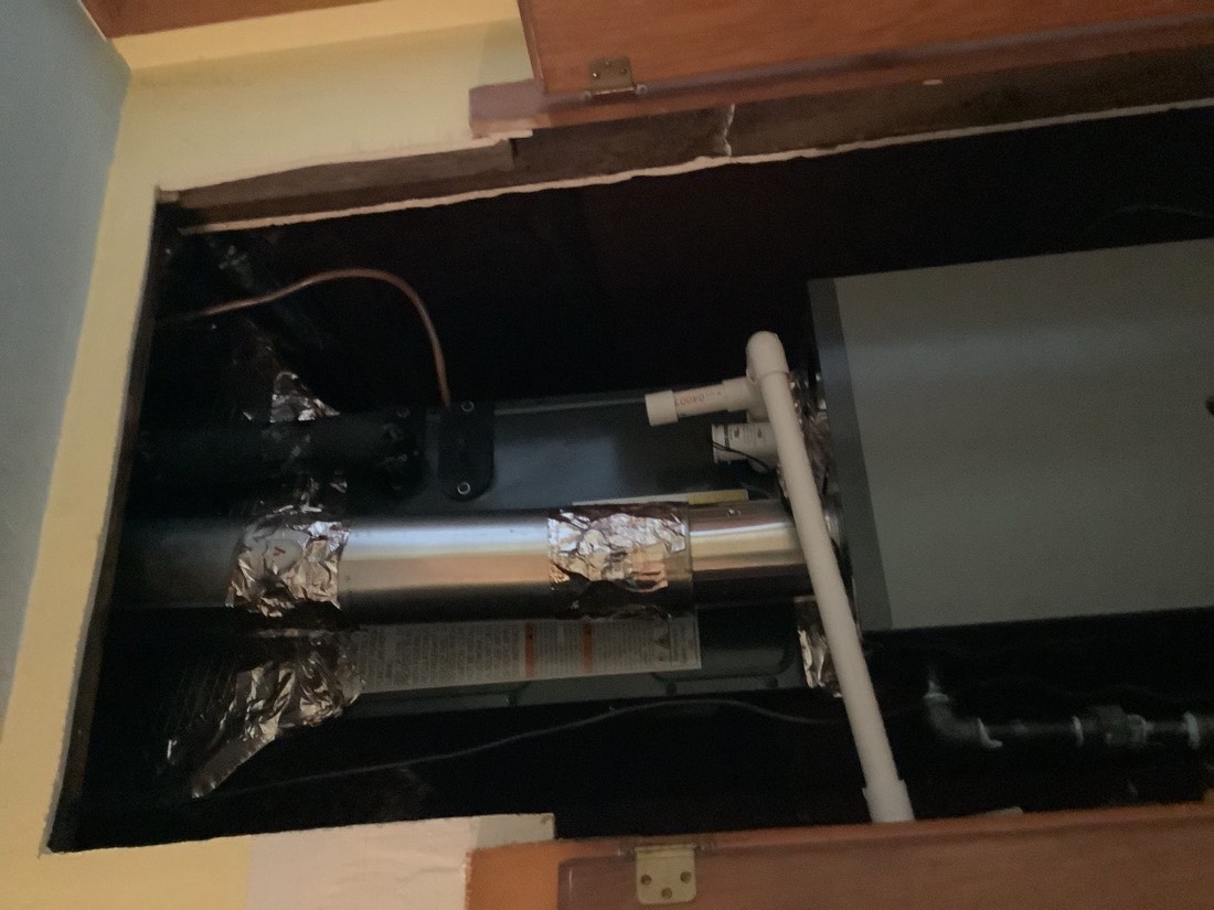Installed water heater and furnace in interior closet