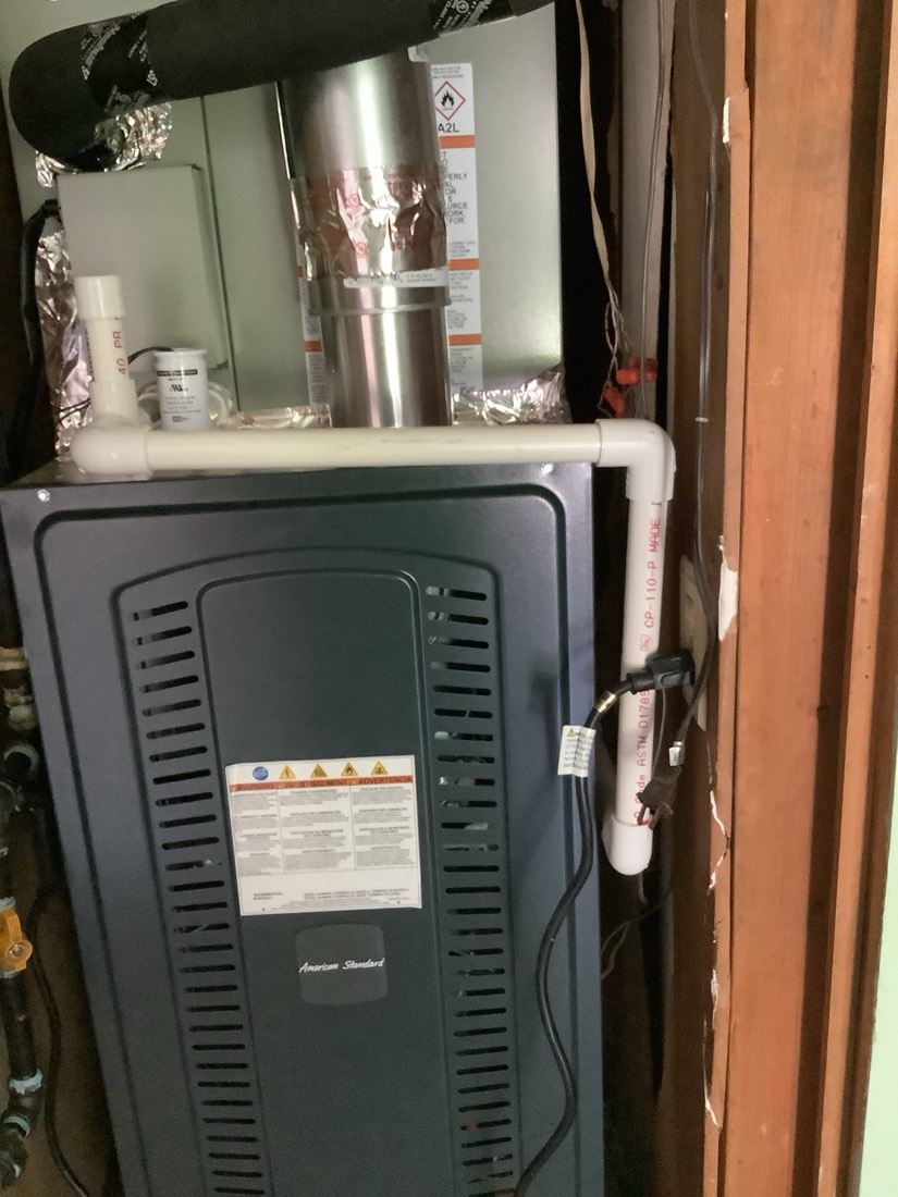HVAC air handler with insulated refrigerant lines installed.