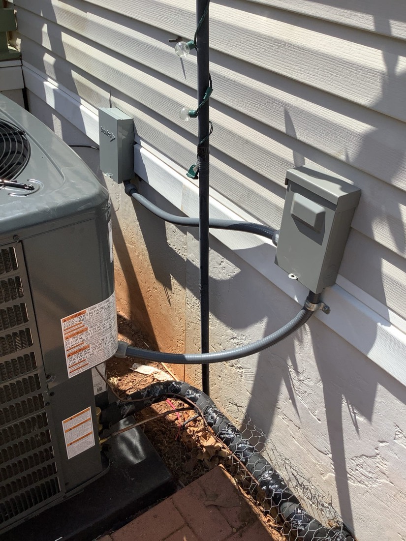 Installed Daikin air conditioning condenser and refrigerant lines