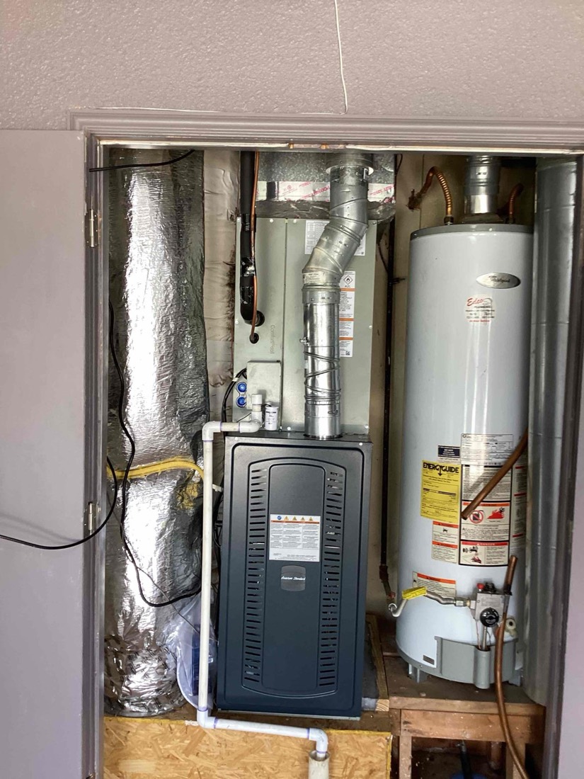 Furnace and water heater installed with ducting and piping