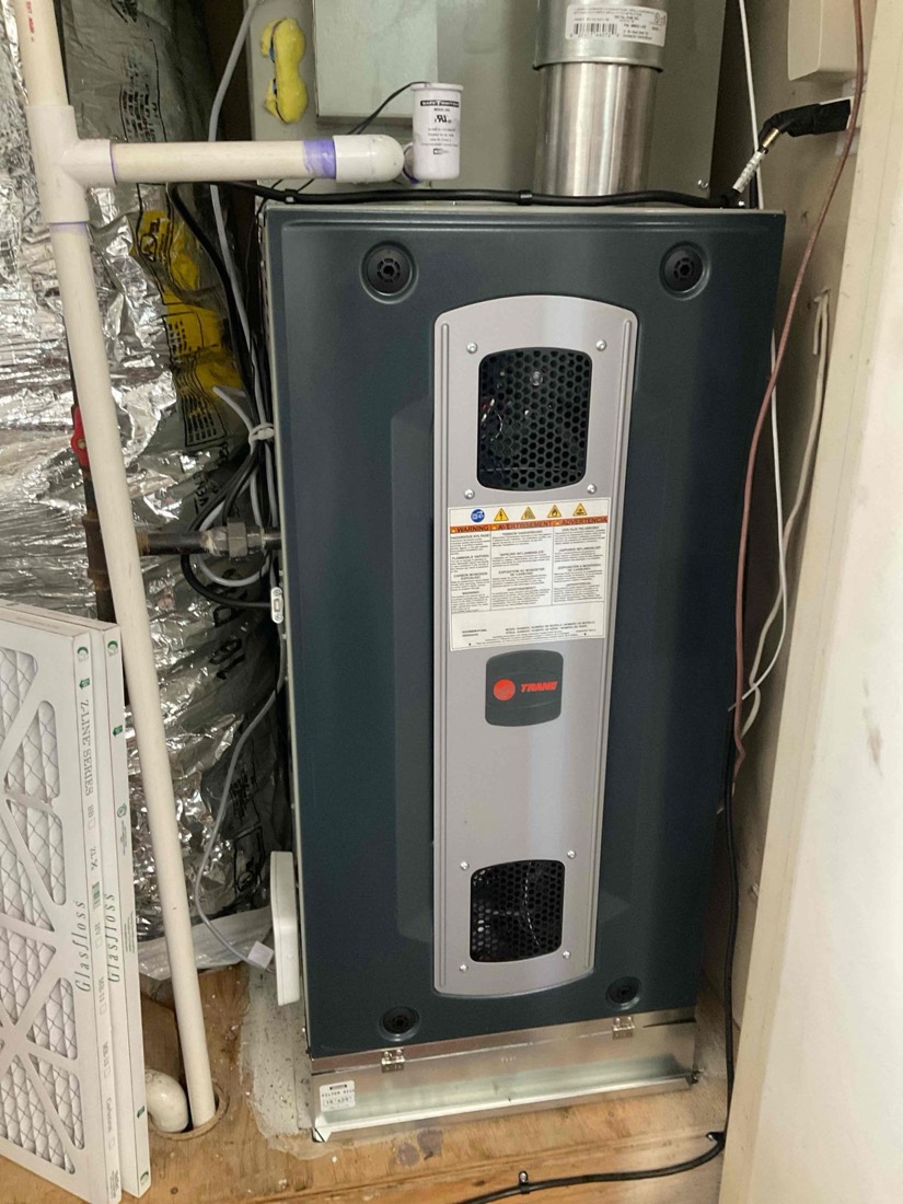 Newly installed furnace with insulation blanket and ductwork in place