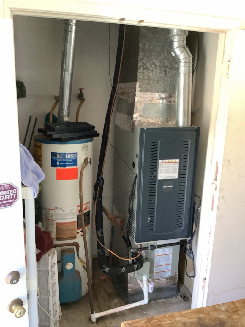 New furnace and air handler unit installed indoors