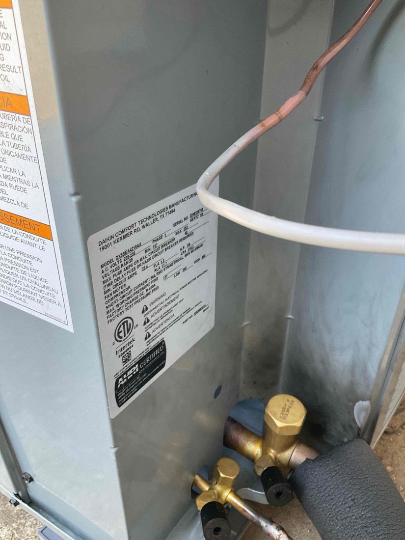 Air handler unit with refrigerant service valves.