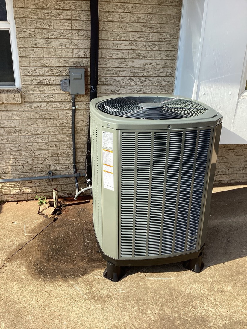 New air conditioning unit with electrical disconnect mounted on wall