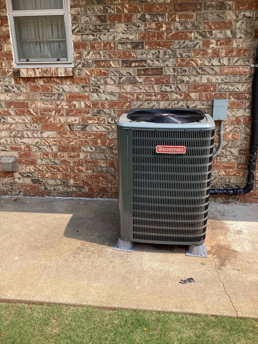 Goodman AC unit installed by home exterior