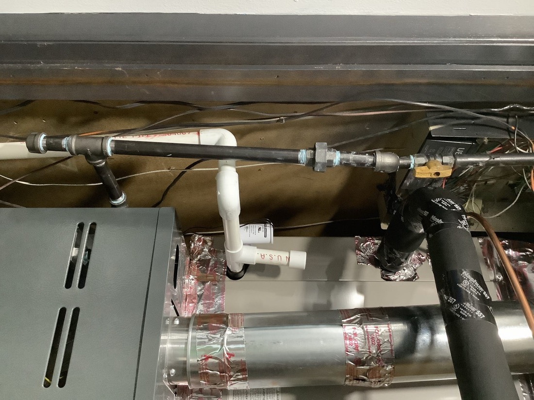 Sealed refrigerant lines and insulation in HVAC installation.