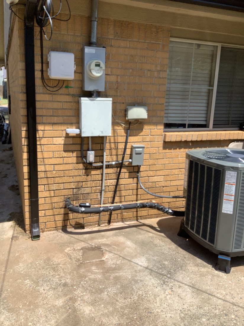 Installed HVAC system with furnace, condenser unit, and electrical panel