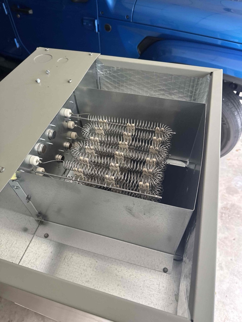 Clean, bright electric heating element coils mounted in HVAC unit