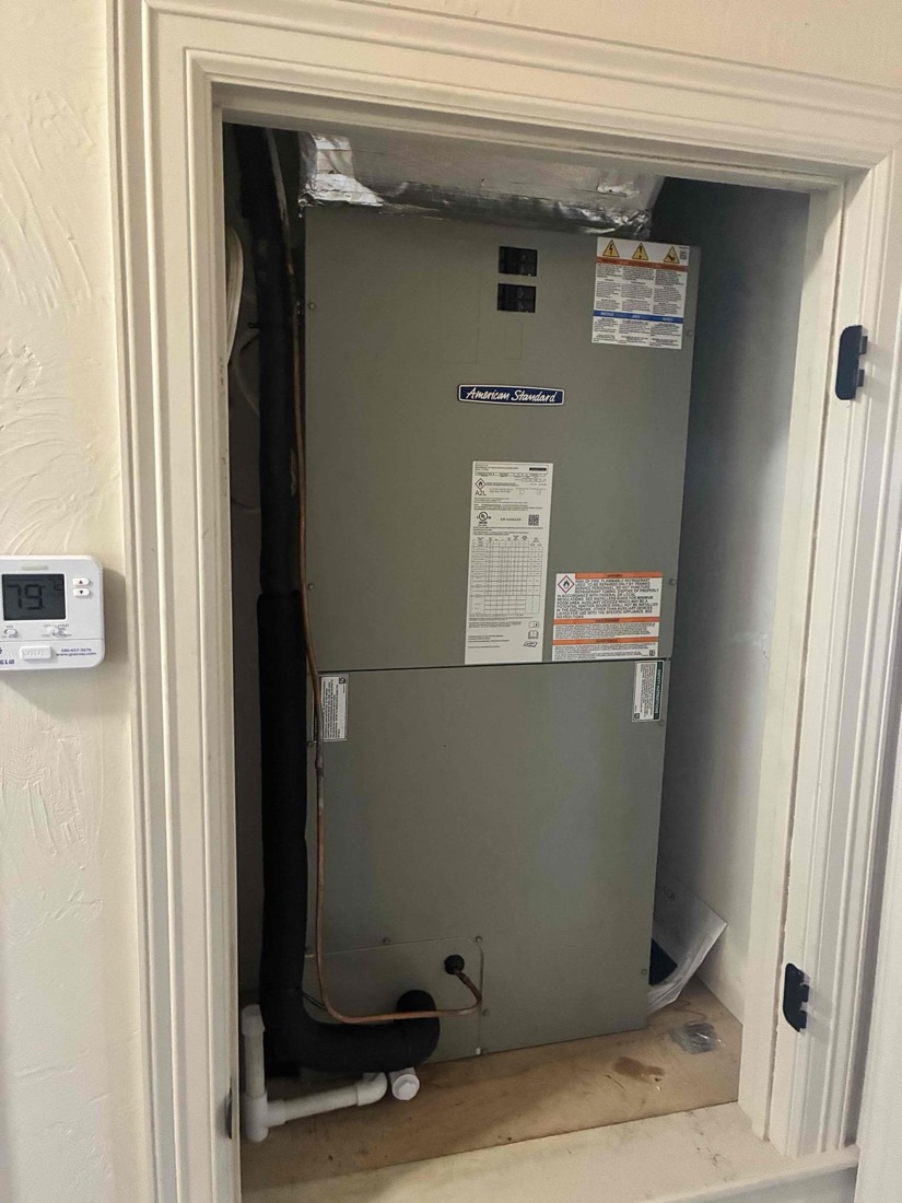 Installed air handler unit in wall cavity with electrical connections
