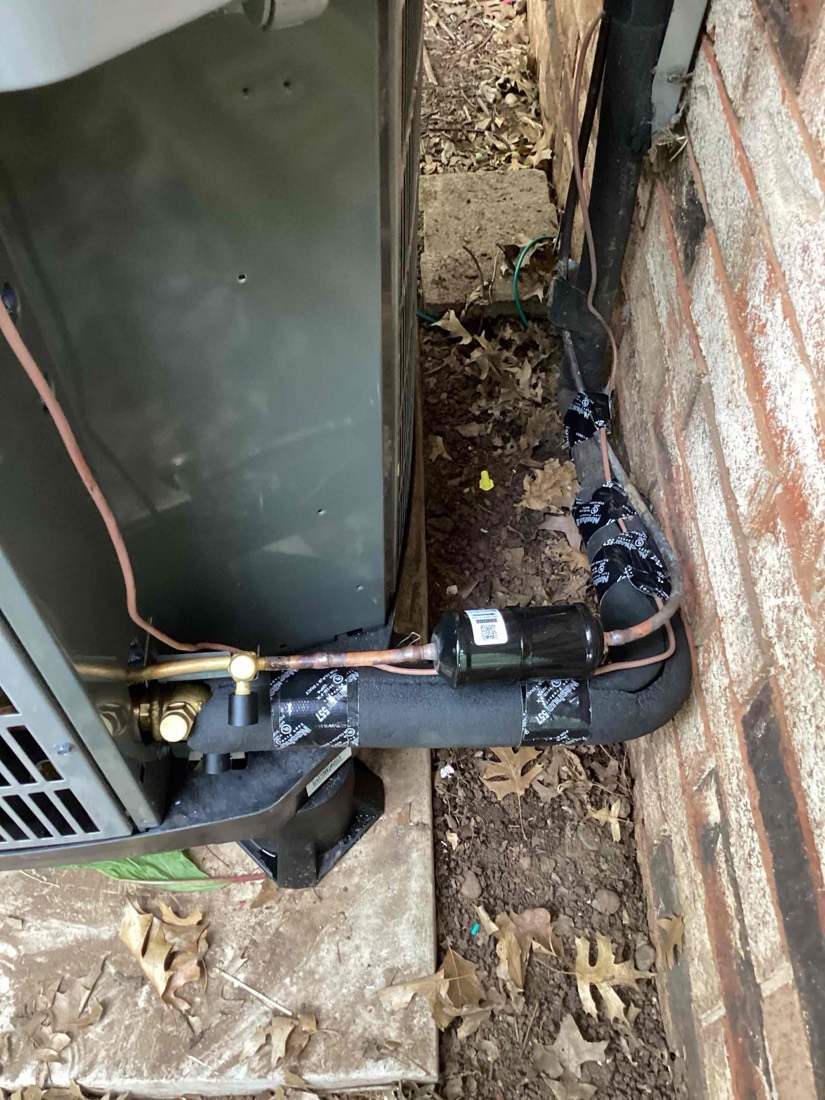 Outdoor heat pump condenser with copper line set and electrical connections