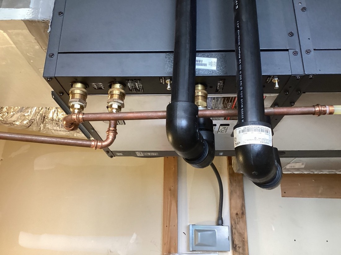 Water heater drain pan and piping connections with isolation valves