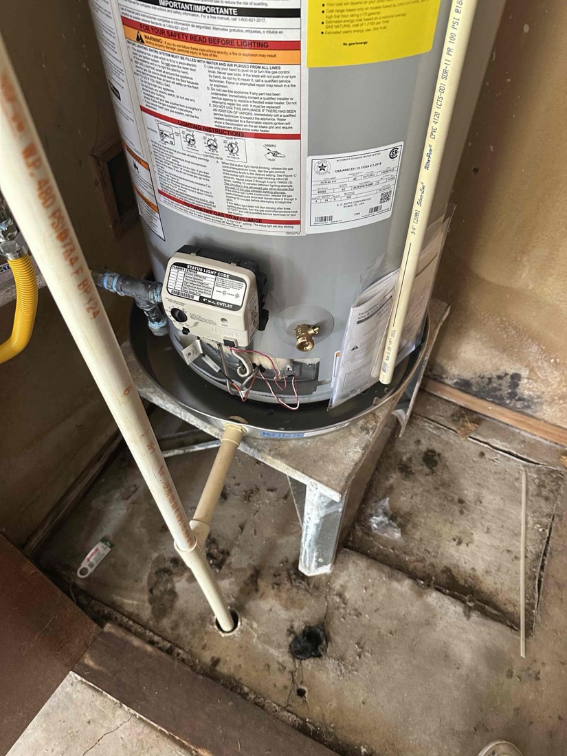 Newly installed water heater with connections and stand