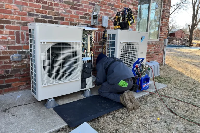 Heat pump energy efficiency explained - Call Triple Play Home Services HVAC tech working on a dual heat pump.