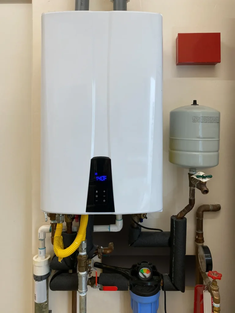 Tankless water heater mounted on wall of home